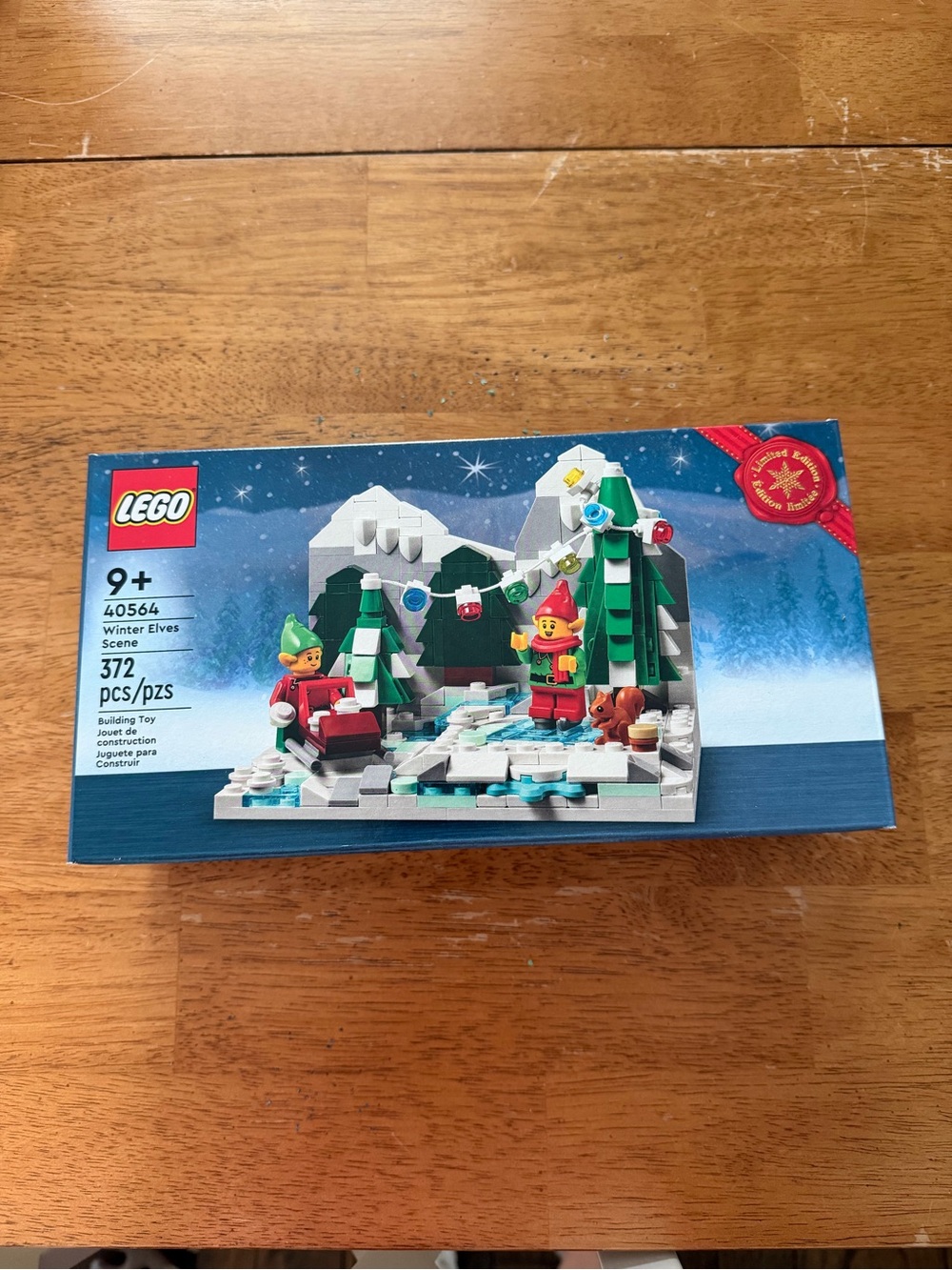 LEGO Winter Elves Scene with Red Sled and Green Trees